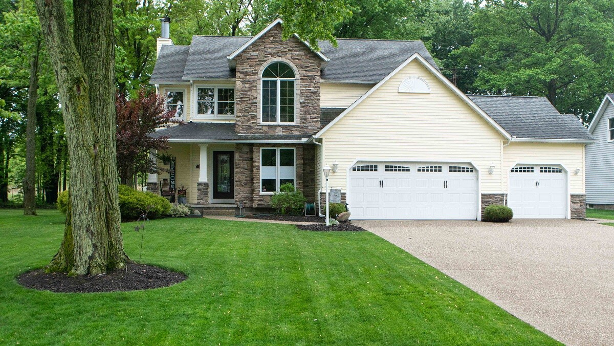 green grass in front of house