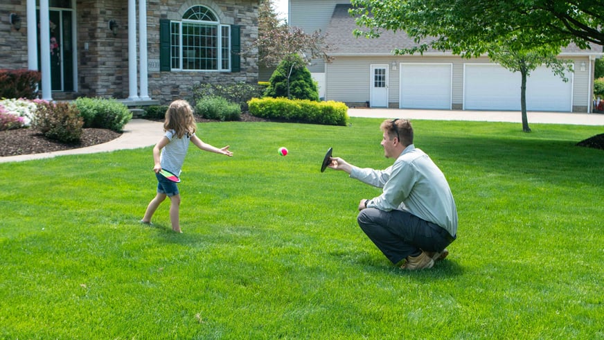 technician-throwing-ball-with-girl