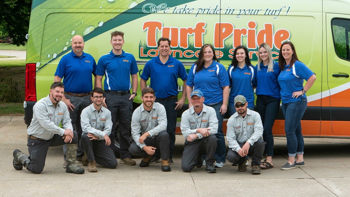 Turf pride team photo in front of truck