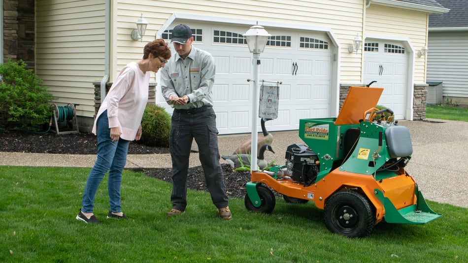 lawn technician with soil in hands