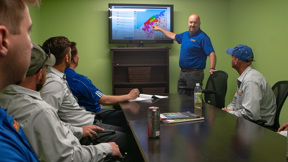 lawn care crew in meeting room