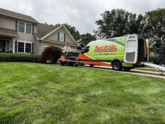 crew on machine front yard wth truck-1