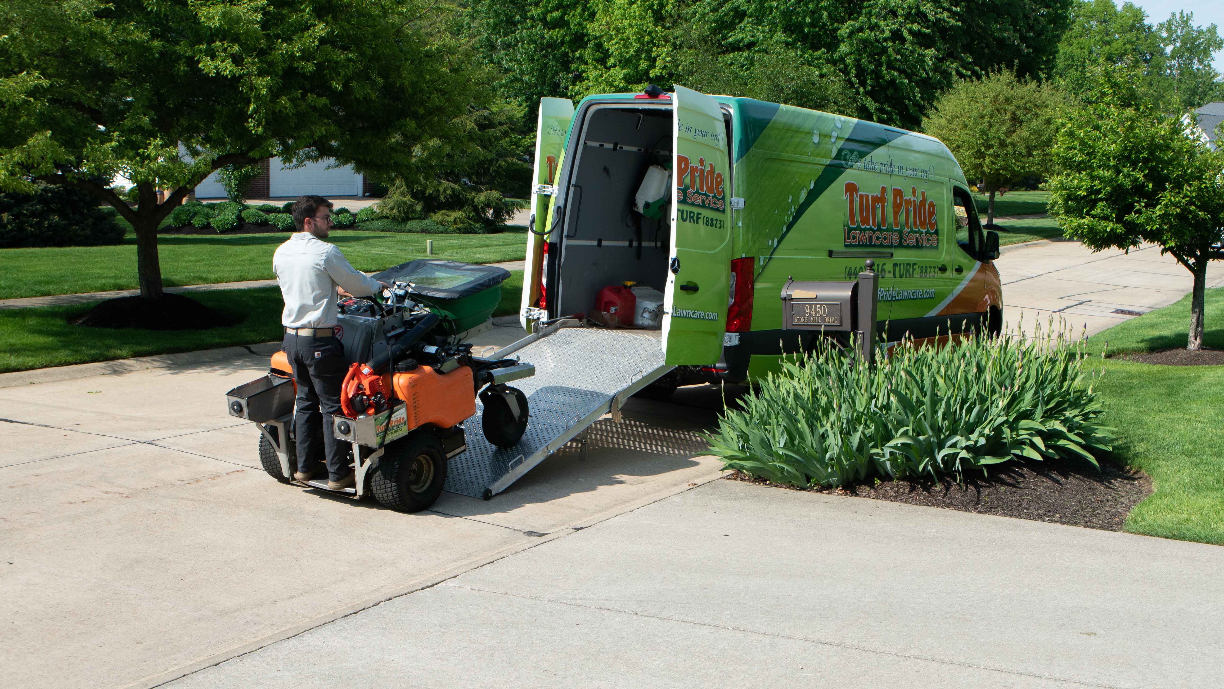 technician taking machine out of truck